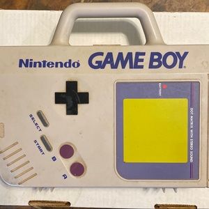 Vintage 1990’s game boy case, game boy , wall charger, and four games.